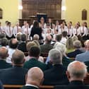 Attendees at Eva Martin's memorial service listen to the school choir in Lisbellaw Presbyterian Church at a 50th anniversary service for her death