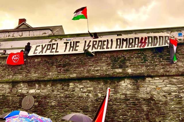 A banner on Londonderry city walls calling for the Israeli ambassador to Ireland to be expelled (note the replacement of the letter 'S' with the insignia of the Nazi SS)
