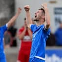 Celebration time for Dungannon Swifts captain Ryan Mayse and his team-mates following a 2-0 second-leg victory in the Premiership promotion/relegation play-off against second-tier Annagh United that secured senior football next season at Stangmore Park
