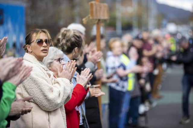 People applauding after taking part in Worship Between the Gates, part of the Human Peace Wall by the New Life City Church on Northumberland Street in Belfast, between the Unionist community of the Shankill and the Irish Nationalist community of the Falls Road. Picture date: Friday April 6, 2023.