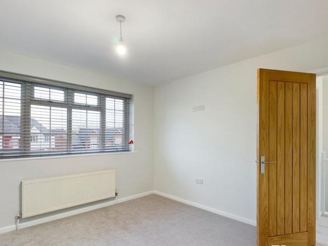 Here is the main bedroom, which overlooks the front of the Shirland property. Spacious and bright, it is begging you to put your individual stamp on it.