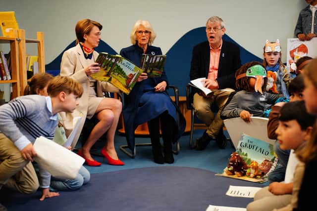 The Queen Consort reading The Gruffalo with Axel Scheffler (right), the illustrator of the children's book during a visit to Rudolf Ross Grundschule School, Hamburg, to hear about the immersive language learning methods the school offers to its students, on the final day of the King and Queen's State Visit to Germany.