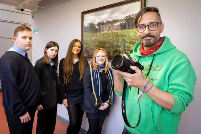1.	Students from Mercy College in north Belfast with artist Robin Price during a workshop at the school organized as part of the Arts Council of Northern Ireland’s Art Lending Scheme.