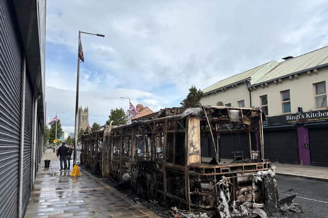 A burned out Gilder bus on Newtownards Road in east Belfast after violence erupted on Tuesday night