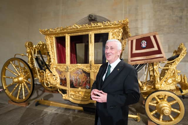 Speaker of the House of Commons, Sir Lindsay Hoyle, is photographed with the Speaker's State Coach which has returned to Westminster for the first time time since 2005. The coach, believed to have been built in the 1690s for King William III and Queen Mary II was last used by Speaker of the House of Commons, George Thomas in 1981 to attend the marriage of the Prince of Wales to Lady Diana Spencer at St Paul's Cathedral. Picture date: Sunday 30 April 2023.