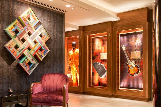 The lobby at the Hard Rock Hotel Dublin with David Bowie's orange boiler suit on display