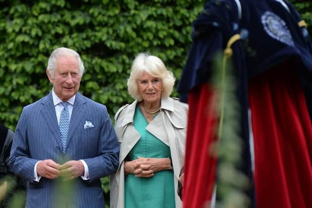 King Charles III and Queen Camilla inspect the special Coronation Robe commissioned by Antrim and Newtownabbey Borough Council, during a two day visit to Northern Ireland.