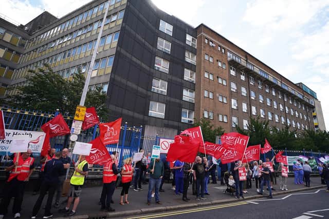 Members of health trade unions take part in a protest outside the Royal Victoria Hospital in Belfast in August, to demand a pay increase to help protect workers from the cost-of-living crisis. Picture date: Wednesday August 24, 2022