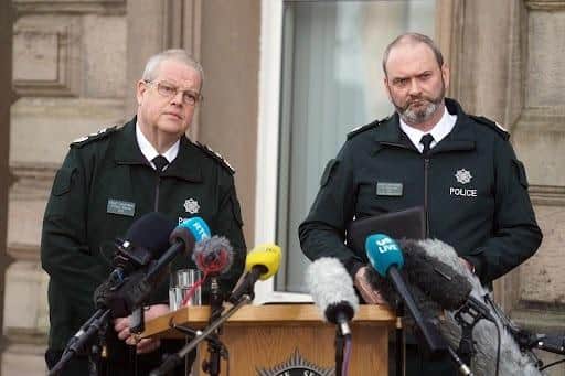 Chief Constable Simon Byrne (left) and Assistant Chief Constable Mark McEwan from the Police Service of Northern Ireland (PSNI) speak to the media outside PSNI headquarters in Belfast, following the shooting of off-duty Detective Chief Inspector John Caldwell on Wednesday evening. Mr Caldwell was shot a number of times by masked men in front of young people he had been coaching. He remains in a critical but stable condition in hospital following the attack. Picture date: Thursday February 23, 2023.