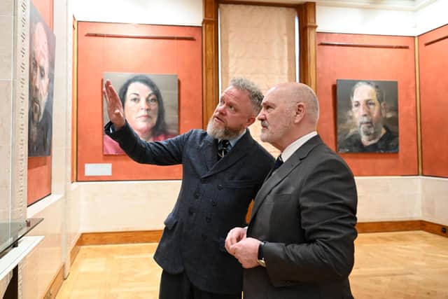 Assembly Speaker, Alex Maskey (left) and portrait artist, Colin Davidson at the launch Colin Davidson's Silent Testimony exhibition at Parliament Buildings, Stormont. The art exhibition focusing on the victims of Northern Ireland's troubled past has gone on display for the 25th anniversary of the Belfast/Good Friday Agreement. Issue date: Friday March 31, 2023.