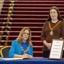 The Lord Mayor of Belfast, Tina Black (left), with Deputy Lord Mayor, Councillor Michelle Kelly, signing a book of condolence in City Hall, Belfast, for those who lost their lives in the recent earthquake in Turkey and Syria. Picture date: Thursday February 16, 2023.