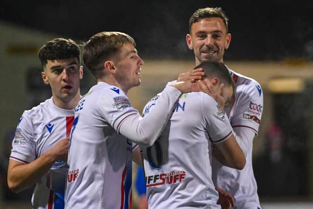 Linfield players celebrate Kyle McClean's opening goal against Dungannon Swifts at Stangmore Park