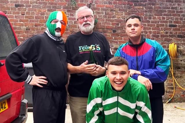 Kneecap with Gerry Adams promoting an upcoming gig in west Belfast