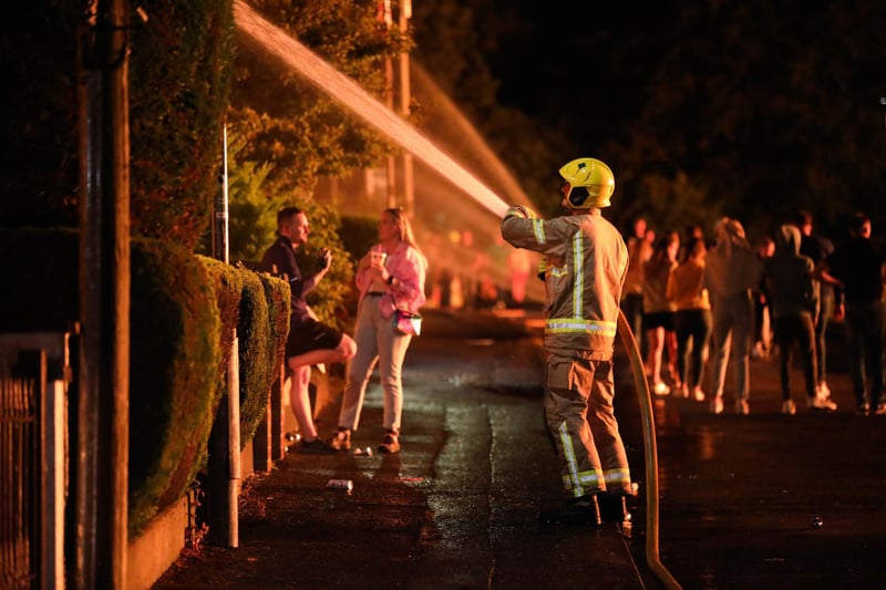 Firemen hosed down nearby properties to keep the exteriors cool and prevent them from catching fire.