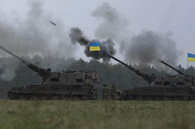 Ukrainian soldiers fire an AS90 as they take part in a military exercise at a training camp in an undisclosed location in England, Friday, March 24, 2023.