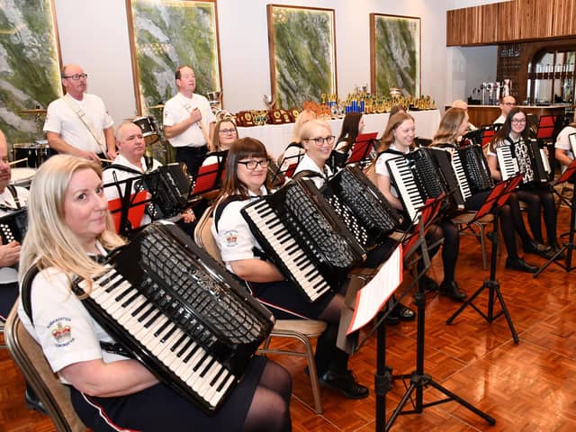 Aughafatten Accordion Band from Broughshane, led by Moira McKee, on the stage ready to play at the festival.