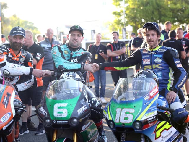 Michael Dunlop (MD Racing/SC Project Paton) celebrates winning his 24th TT in the first Supertwin race with runner-up Mike Browne (Burrows Engineering/RK Racing Paton) and third-placed Jamie Coward (KTS Racing/Steadplan Kawasaki)