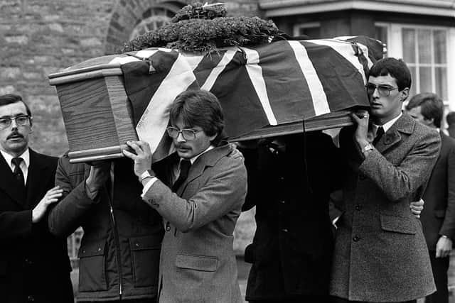Funeral of Charles Armstrong in Armagh who was killed by the IRA. Sons Henry (front) and Freddie carry the coffin. 17/11/83