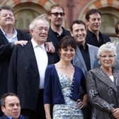 File photo dated 06/07/11 of (left to right) Robie Coltrane, Warwick Davis, Michael Gambon, David Thewlis, Helen McCrory, Nick Moran, Jason Isaacs, Julie Walters, Ralph Fiennes and Natalia Tena during a photocall with the Cast of Harry Potter And The Deathly Hallows, Part 2, at St. Pancras Renaissance London Hotel.