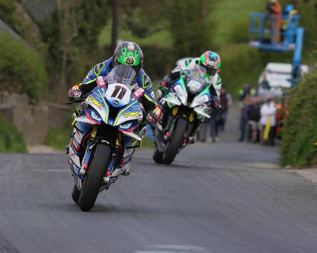 Dominic Herbertson (Burrows Engineering/RK Racing BMW) narrowly beat Michael Sweeney (MJR BMW) in the Cookstown 100 Superbike race to seal a four-timer