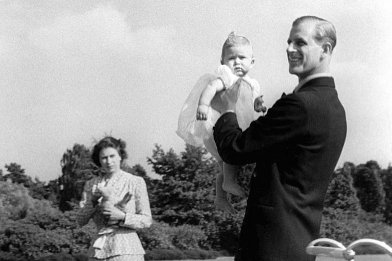 File photo dated 18/07/49 of Prince Charles being lifted up by his father the Duke of Edinburgh, in the grounds of Windlesham Moor, the country home in Surrey of Princess Elizabeth and the Duke. Issue date: Wednesday April 26, 2023. PA Photo. See PA story ROYAL Coronation King. Photo credit should read: PA Wire