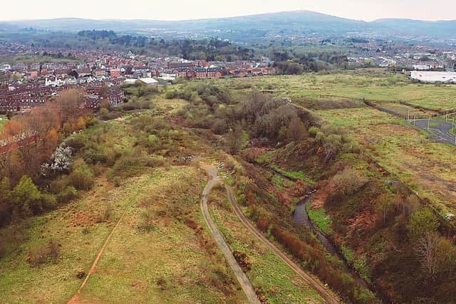 Campaigners are calling for social housing to be built on the Mackies 25 acre site in West Belfast