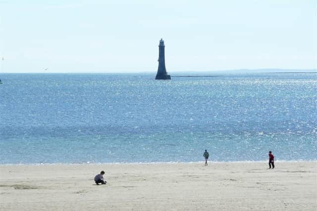 Cranfield beach and lighthouse. In February 1803 the News Letter reported that the light was to be lit on March 1, 1803 "and continue thereafter lighted from the expiration of day-light in the evenings until day-light in the mornings".