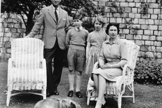 **Scanned low-res off contact** Queen Elizabeth II and the Duke of Edinburgh with their two children, the Prince of Wales and Princess Anne at Windsor Castle. With them is Sugar, one of the Queen's pet corgis.:PA:King Charles lll