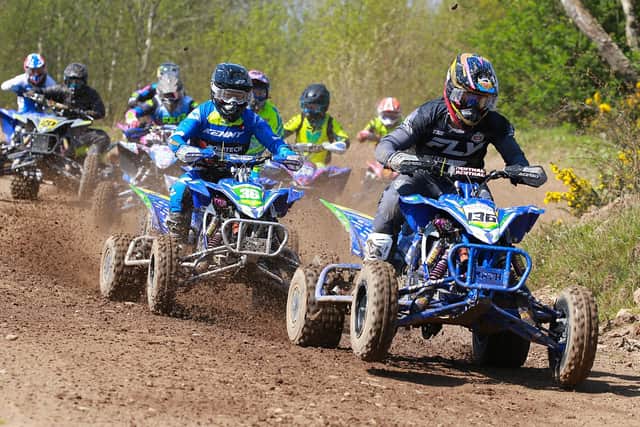 Moira’s Dean Dillon (136) leads brother Ross (36) and the pack in the Premier Quad class. (Photo by Maurice Montgomery)