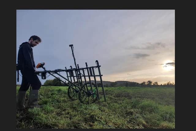 Dr Patrick Gleeson surveying differences in gravity across the site in Armagh to assess buried archeological features.