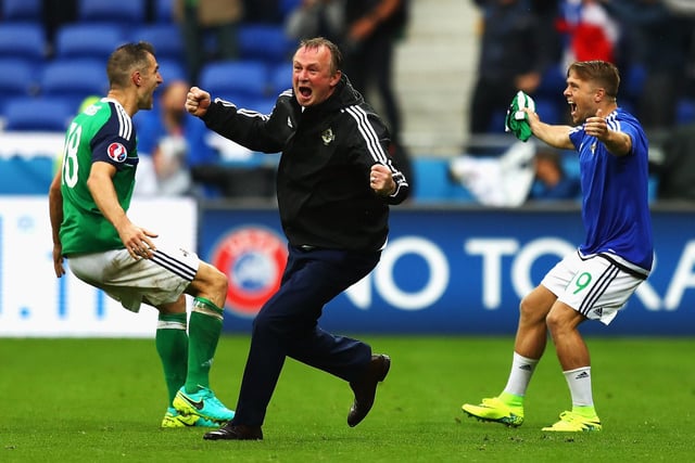 Michael O'Neill (C) manager of Northern Ireland celebrate his team's second goal with Aaron Hughes (L) and Jamie Ward (R) during the UEFA EURO 2016 Group C match between Ukraine and Northern Ireland at Stade des Lumieres on June 16, 2016 in Lyon, France.  (Photo by Julian Finney/Getty Images)