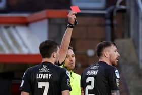 Referee Christopher Morrison sends off Billy Joe Burns during Crusaders' defeat to Larne, meaning the defender will miss the upcoming Irish Cup final.