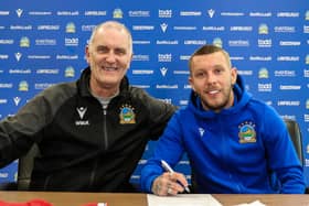 Kirk Millar signs his new contract with Linfield. PIC: Pacemaker