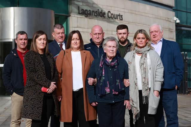 The widow of murdered GAA official Sean Brown, Bridie Brown (fourth from right) with family and friends, and solicitor Niall Murphy (third from left), outside Laganside Court. . Photo: Liam McBurney/PA Wire