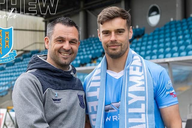 Ballymena United manager Jim Ervin welcomes Matthew Clarke to the club. (Photo by Ballymena United)