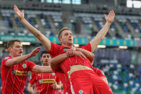 Jonny Addis celebrates after scoring Cliftonville's first goal in their 2-0 win over Larne. PIC: Desmond Loughery/Pacemaker Press
