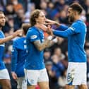 Rangers' Fabio Silva celebrates with Connor Goldson (far right) after making it 5-0 during a cinch Premiership match between Rangers and Heart of Midlothian at Ibrox Stadium