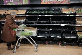 Empty fruit and vegetable shelves at an Asda supermarket in east London. Picture date: Tuesday February 21, 2023.