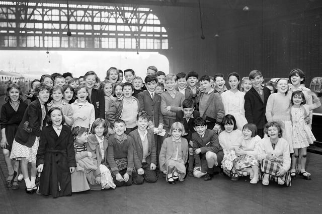 Children from Edinburgh and Leith School leave Princes Street Station for a trip to West Coast funded by the Courant Fund in July 1963.