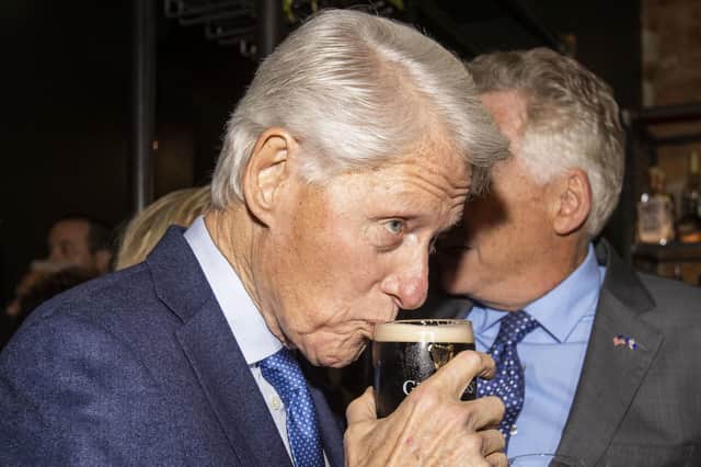 Former US president Bill Clinton drinking a pint of Guinness at the Guildhall Taphouse after his speech in Londonderry's Guildhall on Tuesday night