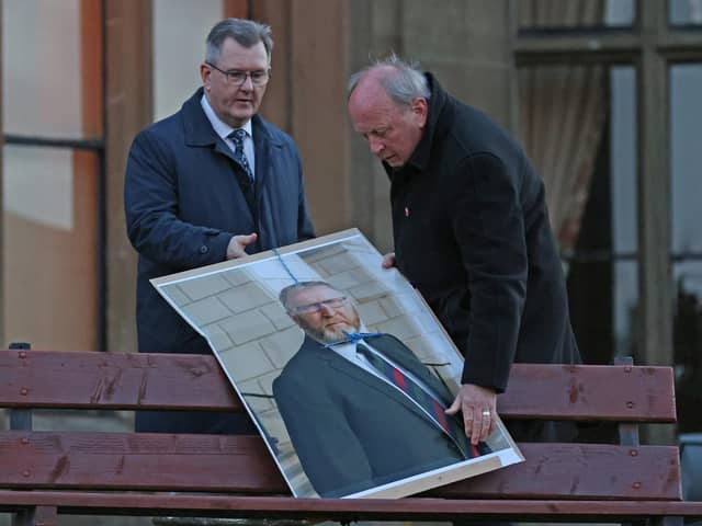 Jim Allister (right) and DUP leader Sir Jeffrey Donaldson with a defaced poster of the leader of the UUP Doug Beattie, during a rally in opposition to the NI Protocol in Lurgan in 2022. Photo: Liam McBurney/PA
