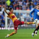 Jagiellonia Bialystock's Taras Romanchuk fouls Rangers' Dan Neil during the Europa League qualifying match at Ibrox Stadium, Glasgow