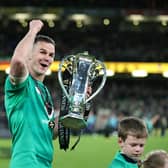Ireland's Johnny Sexton of Ireland celebrates with the Six Nations Trophy after Ireland completed the Grand Slam against England at the Aviva Stadium in Dublin.