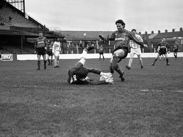 Ballymena United goalkeeper Damian Grant smothers the ball at the feet of Glentoran’s Raymond Campbell during a Smirnoff Irish League match at the Oval, Belfast, at end of February 1992. Picture: News Letter archives