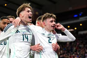 Northern Ireland's Conor Bradley (right) scored his first international goal in a 1-0 friendly victory over Scotland at Hampden Park