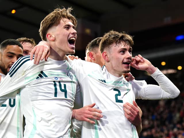 Northern Ireland's Conor Bradley (right) scored his first international goal in a 1-0 friendly victory over Scotland at Hampden Park