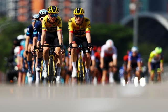 SINGAPORE - OCTOBER 30, 2022: Sepp Kuss of the United States and Team Jumbo-Visma leads the peloton through Esplanade Bridge during the Tour de France Prudential Singapore Criterium on October 30, 2022 in Singapore. (Photo by Yong Teck Lim/Getty Images)