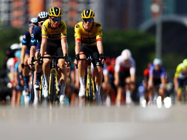 SINGAPORE - OCTOBER 30, 2022: Sepp Kuss of the United States and Team Jumbo-Visma leads the peloton through Esplanade Bridge during the Tour de France Prudential Singapore Criterium on October 30, 2022 in Singapore. (Photo by Yong Teck Lim/Getty Images)