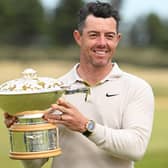 Rory McIlroy poses for a photo with the Genesis Scottish Open trophy on the 18th green after winning the tournament