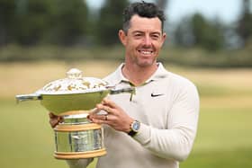 Rory McIlroy poses for a photo with the Genesis Scottish Open trophy on the 18th green after winning the tournament